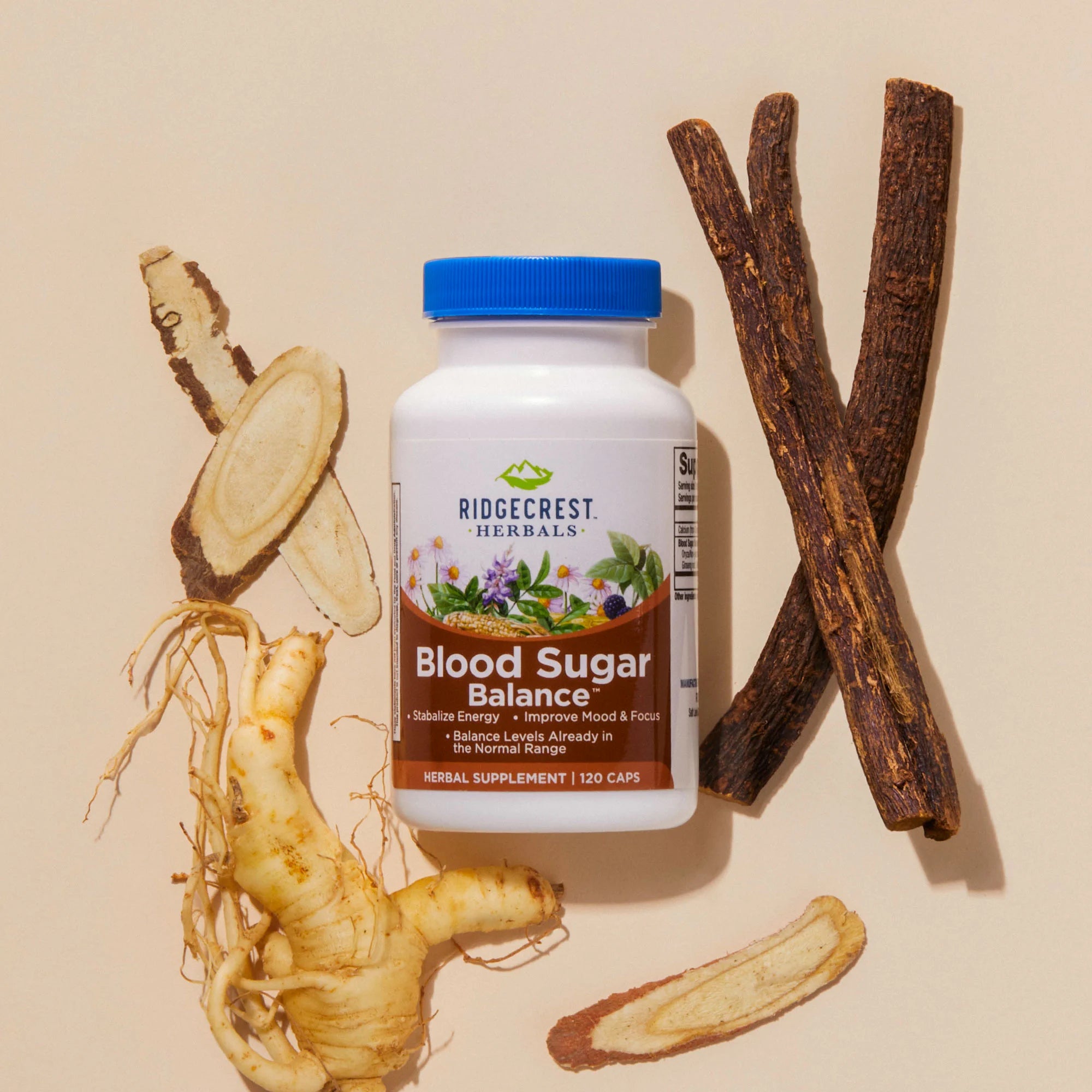 Blood Sugar Balance supplement is displayed with ginseng roots and licorice sticks, set against a beige background.