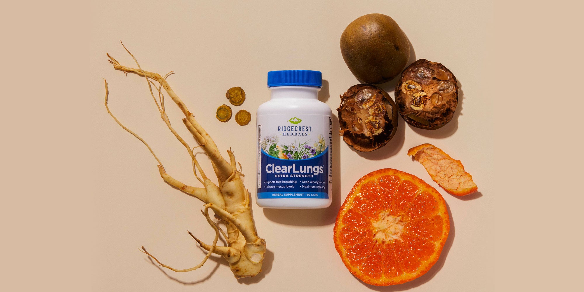 ClearLungs Extra Strength supplement is displayed alongside a sliced orange, dried herbs, roots, and natural ingredients on beige background.