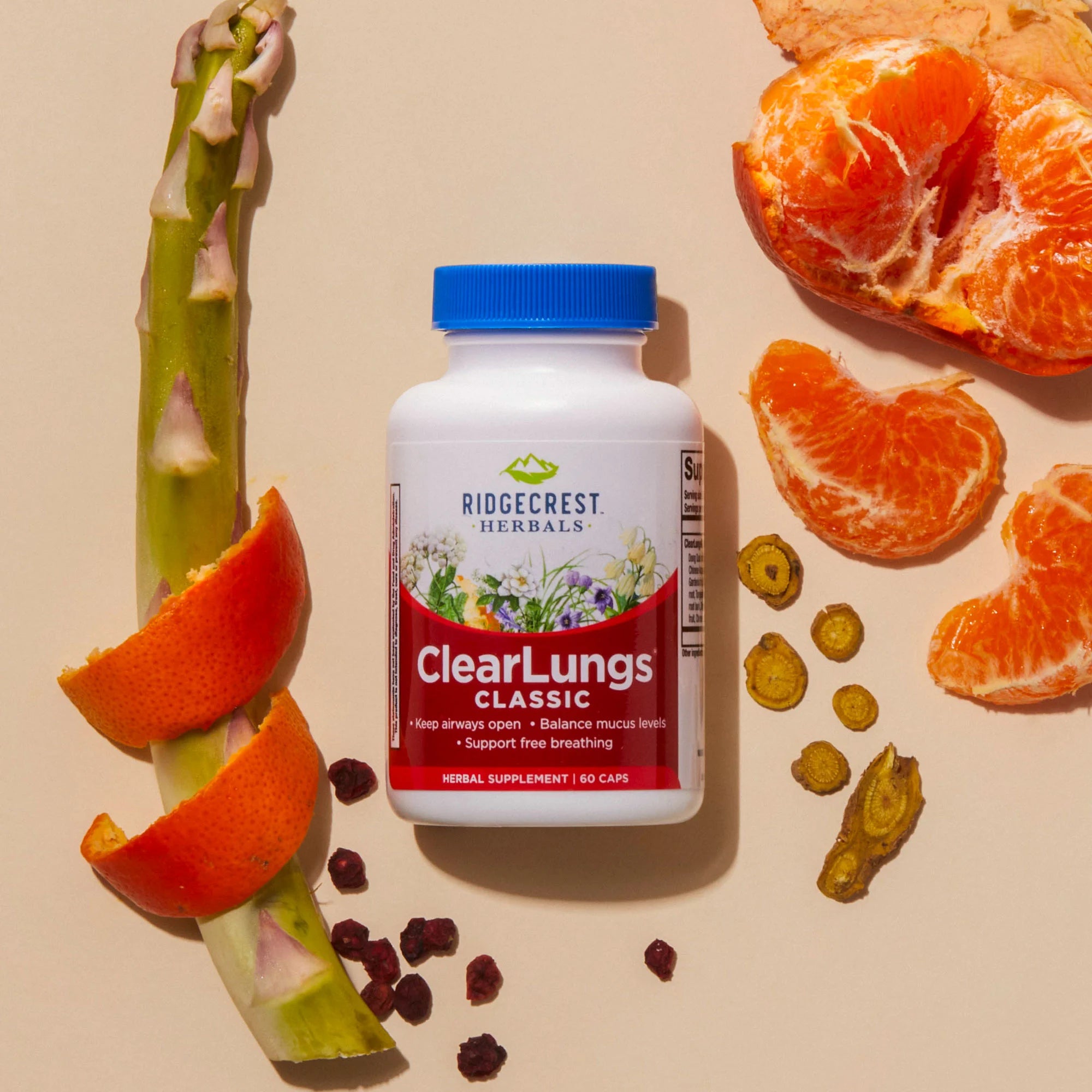 ClearLungs Classic supplement is displayed with a bamboo shoot, orange peel, peeled mandarin segments, and dried herbs, set against a beige background.